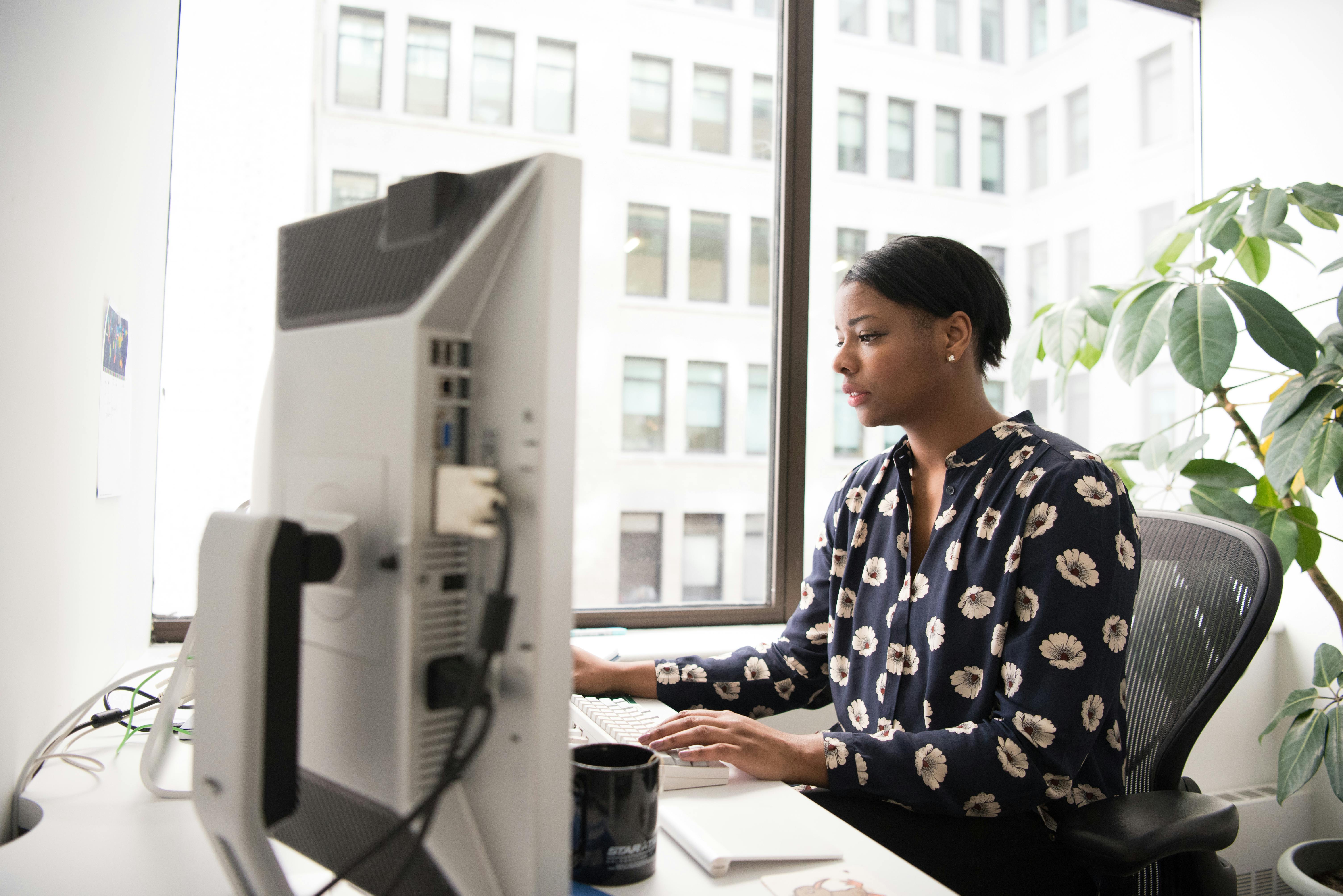 woman using computer in office setting