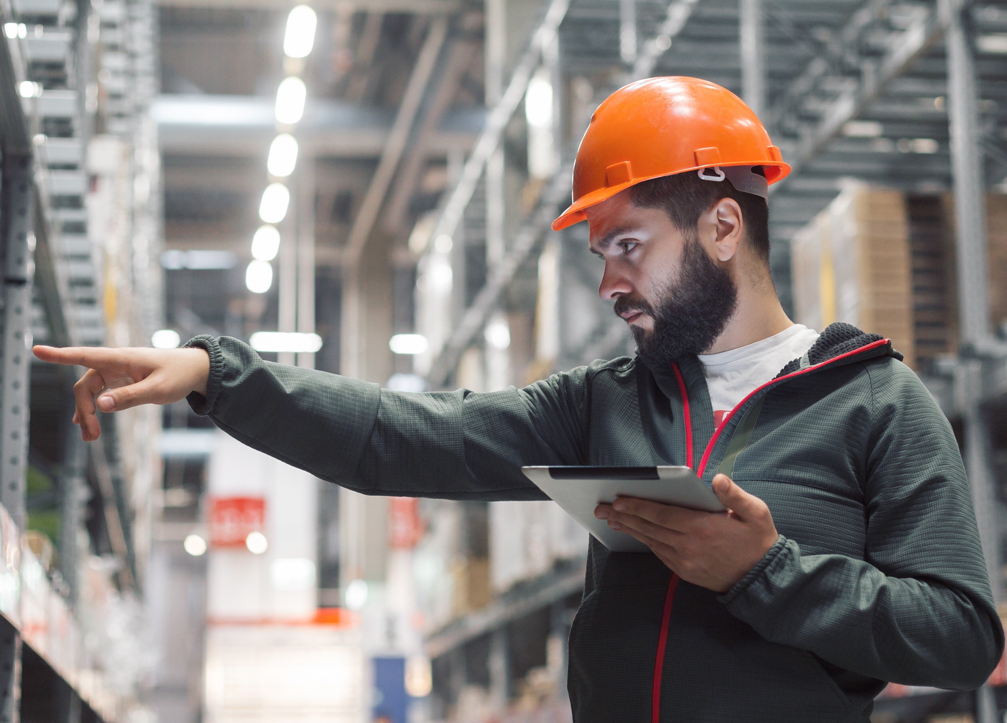 warehouse worker using a tablet and tracking inventory-1